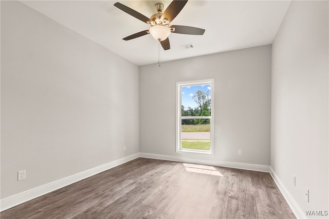 unfurnished room featuring hardwood / wood-style floors and ceiling fan