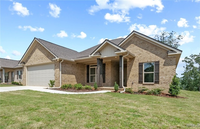 view of front of house featuring a garage and a front lawn