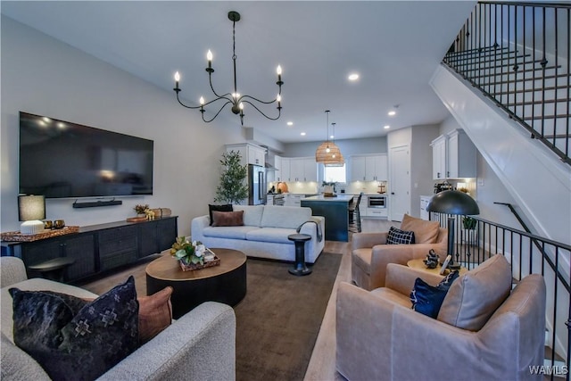 living room featuring recessed lighting, an inviting chandelier, and wood finished floors