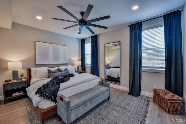 bedroom featuring baseboards, ceiling fan, light wood-style flooring, and recessed lighting