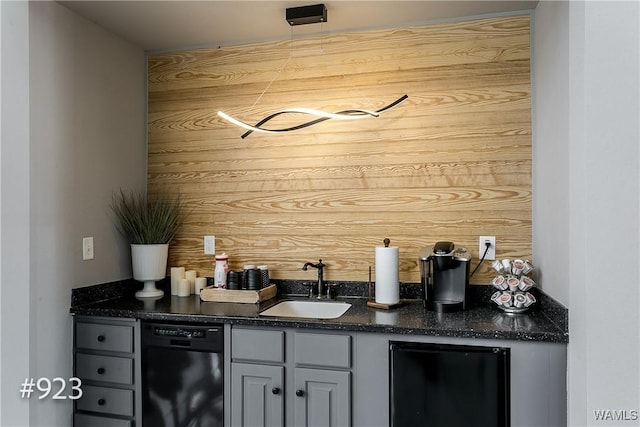 bar featuring a sink, wet bar, black dishwasher, and refrigerator