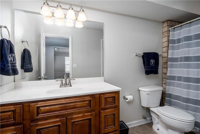 bathroom with tile patterned floors, toilet, and vanity