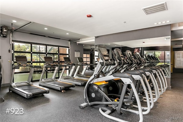 exercise room featuring recessed lighting and visible vents