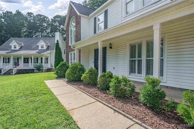 4410 Nicholas Ave, Northport, AL 35473 - entrance to property featuring a porch and a yard
