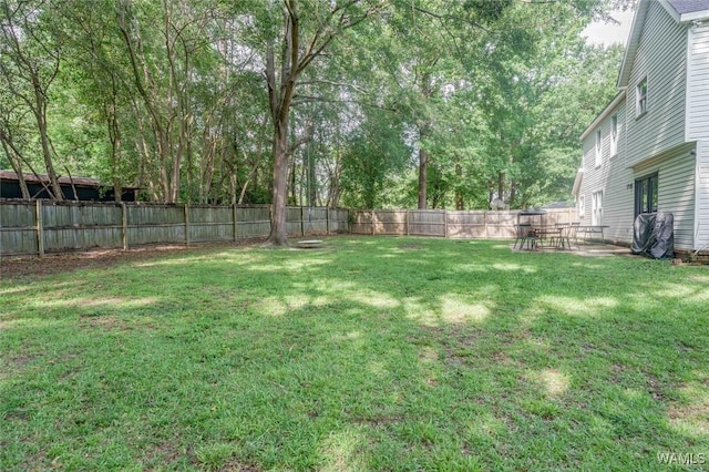 4410 Nicholas Ave, Northport, AL 35473 - fenced backyard featuring a patio area