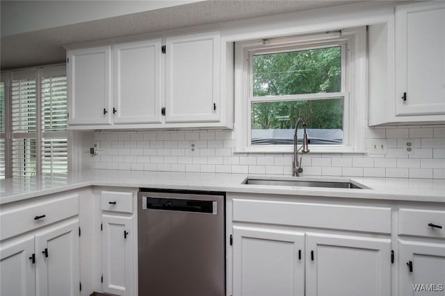 4410 Nicholas Ave, Northport, AL 35473 - kitchen featuring dishwasher, white cabinetry, backsplash, and light countertops