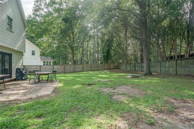 4410 Nicholas Ave, Northport, AL 35473 - fenced backyard with a patio