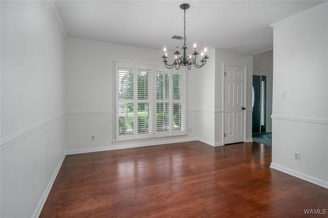 4410 Nicholas Ave, Northport, AL 35473 - unfurnished dining area with a chandelier, wood finished floors, and crown molding