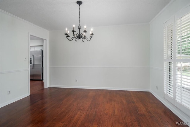 4410 Nicholas Ave, Northport, AL 35473 - unfurnished dining area featuring a chandelier, wood finished floors, and crown molding