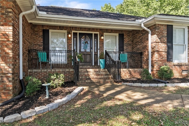 doorway to property featuring covered porch