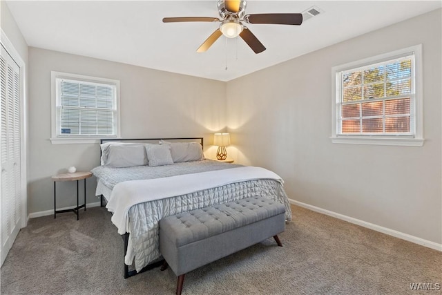 bedroom featuring ceiling fan, carpet, and a closet