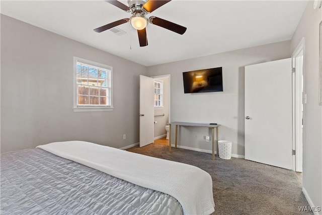 bedroom featuring ceiling fan, connected bathroom, and carpet flooring