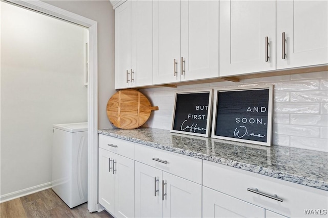 laundry area featuring light wood-type flooring