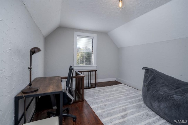 11 Audubon Pl, Tuscaloosa, AL 35401 - office space featuring a textured wall, vaulted ceiling, a textured ceiling, wood finished floors, and baseboards