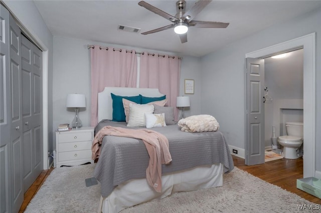 11 Audubon Pl, Tuscaloosa, AL 35401 - bedroom with a closet, visible vents, ensuite bath, wood finished floors, and baseboards