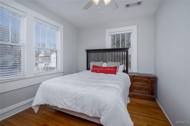 11 Audubon Pl, Tuscaloosa, AL 35401 - bedroom with ceiling fan, wood finished floors, visible vents, and baseboards