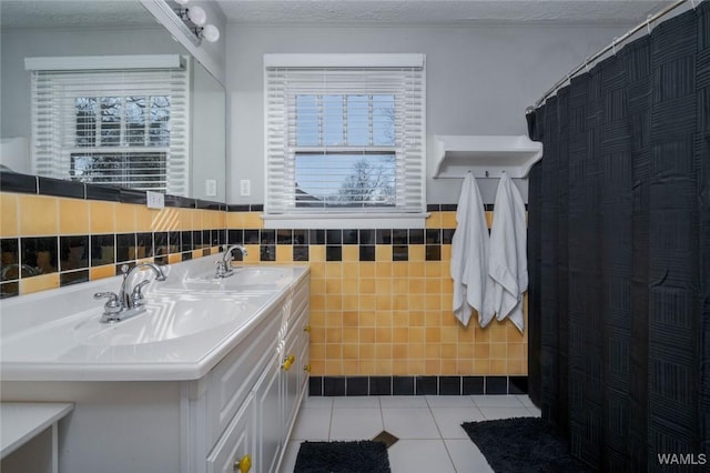 11 Audubon Pl, Tuscaloosa, AL 35401 - bathroom with plenty of natural light, tile patterned flooring, a sink, and double vanity