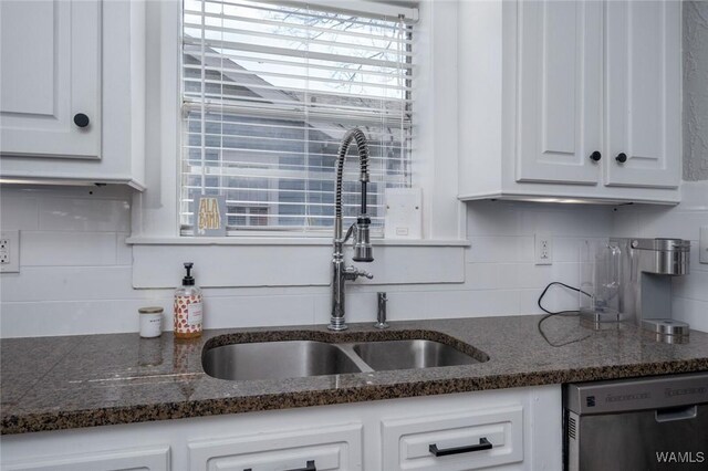11 Audubon Pl, Tuscaloosa, AL 35401 - kitchen featuring dishwasher, dark countertops, a sink, and white cabinetry