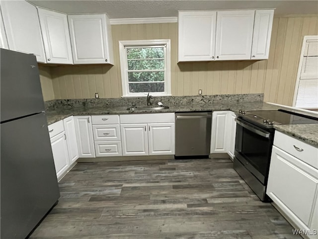 kitchen with white cabinets, dark hardwood / wood-style flooring, sink, and stainless steel appliances