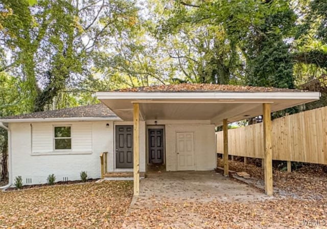 view of front of home featuring a carport