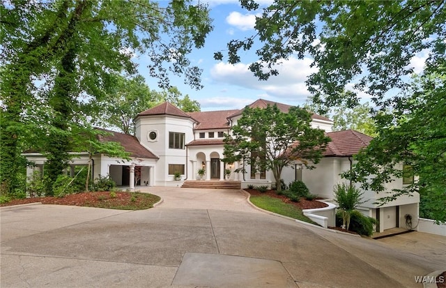 6821 Jade Pt, Tuscaloosa, AL 35406 - mediterranean / spanish home with stucco siding, driveway, and a tiled roof