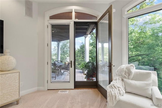 6821 Jade Pt, Tuscaloosa, AL 35406 - doorway to outside featuring carpet flooring and baseboards