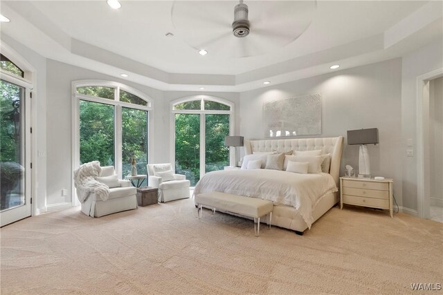 6821 Jade Pt, Tuscaloosa, AL 35406 - carpeted bedroom featuring access to exterior, a tray ceiling, and recessed lighting