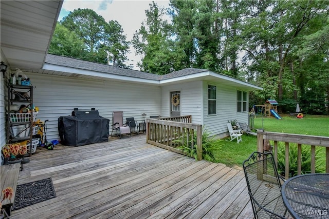 4402 Lakeshore Dr, Northport, AL 35473 - wooden terrace with a yard, a grill, and a playground