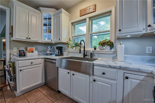 4402 Lakeshore Dr, Northport, AL 35473 - kitchen featuring dishwasher, white cabinets, glass insert cabinets, and light tile patterned floors
