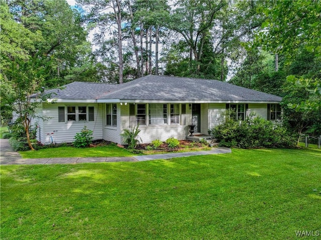 4402 Lakeshore Dr, Northport, AL 35473 - ranch-style house featuring a front lawn and roof with shingles