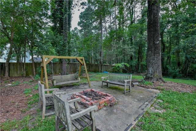 4402 Lakeshore Dr, Northport, AL 35473 - fenced backyard with an outdoor fire pit and a patio