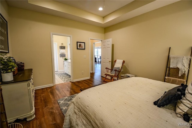 12464 Timberlane Rd, Ralph, AL 35480 - bedroom with wood finished floors, baseboards, a tray ceiling, recessed lighting, and ensuite bathroom
