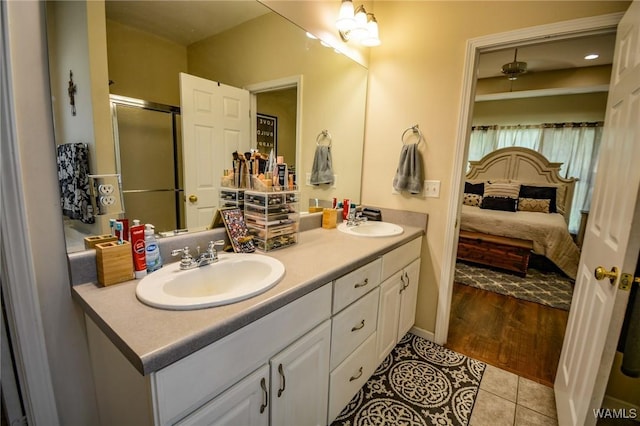 12464 Timberlane Rd, Ralph, AL 35480 - bathroom with double vanity, tile patterned floors, an enclosed shower, and ensuite bath