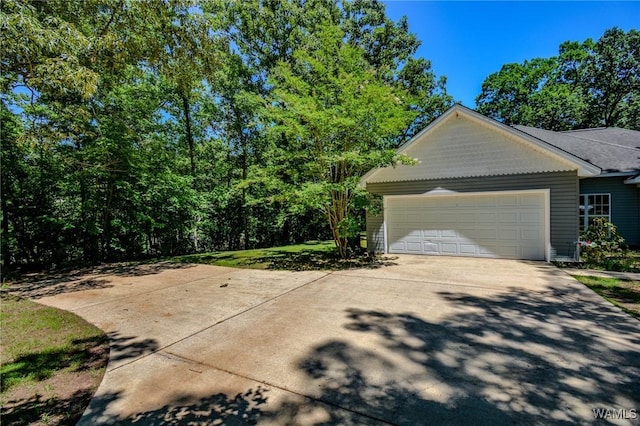 12464 Timberlane Rd, Ralph, AL 35480 - view of side of home with concrete driveway and an attached garage