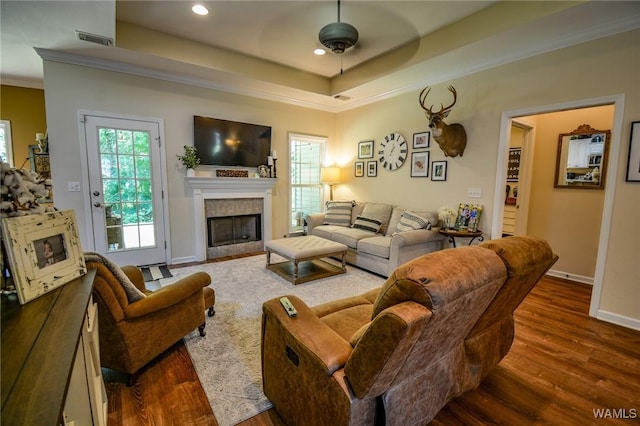12464 Timberlane Rd, Ralph, AL 35480 - living room featuring dark wood-style flooring, a ceiling fan, a tile fireplace, crown molding, and recessed lighting
