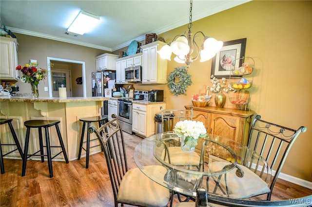 12464 Timberlane Rd, Ralph, AL 35480 - dining room featuring light wood-style flooring, a chandelier, and crown molding