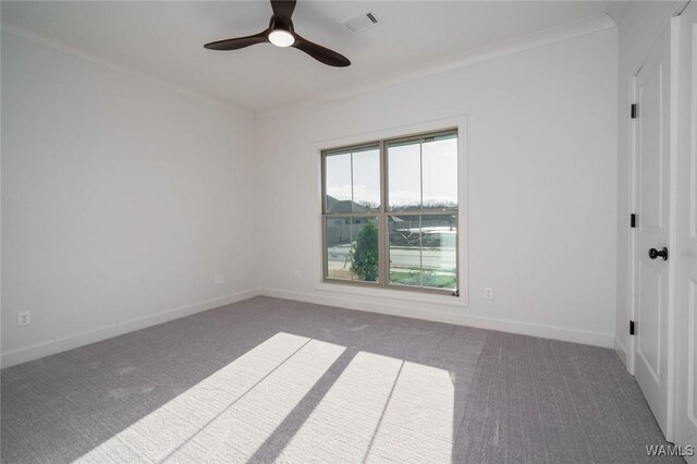 13713 Blackoak Dr, Northport, AL 35475 - carpeted spare room with visible vents, crown molding, baseboards, and ceiling fan
