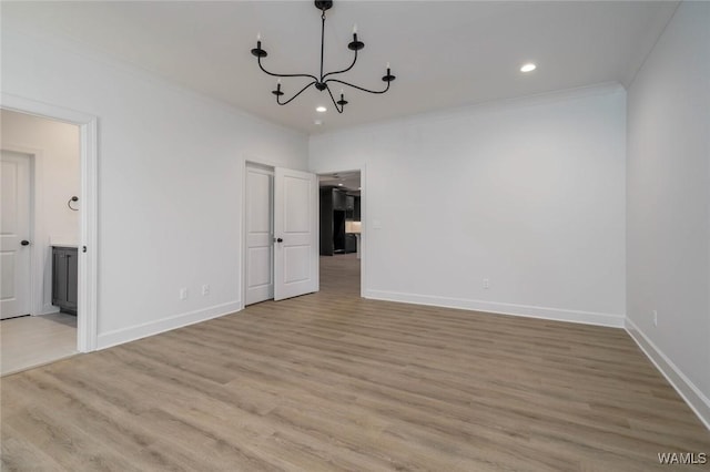 13713 Blackoak Dr, Northport, AL 35475 - unfurnished dining area with light wood finished floors, baseboards, ornamental molding, an inviting chandelier, and recessed lighting