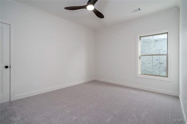 13713 Blackoak Dr, Northport, AL 35475 - spare room with ornamental molding, carpet, visible vents, and baseboards