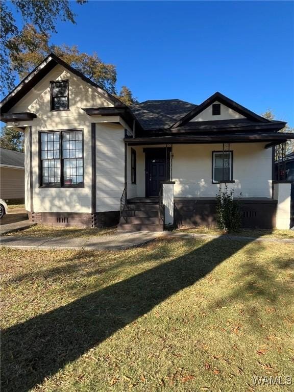 view of front of home with a front lawn