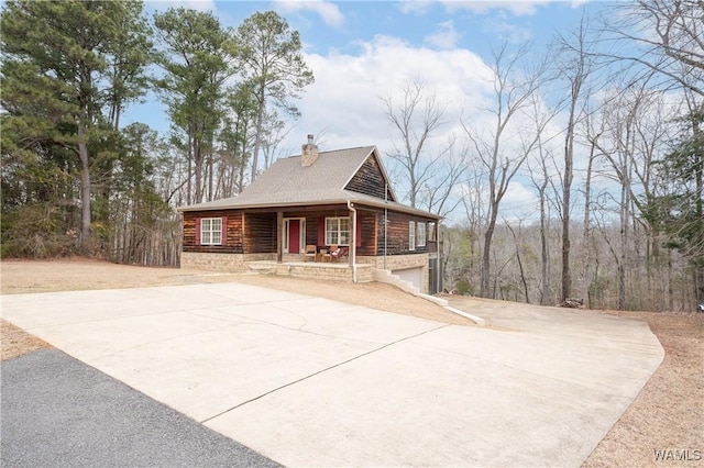 view of front of home featuring a garage and a porch