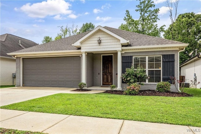 ranch-style home featuring a front yard, concrete driveway, a garage, and roof with shingles
