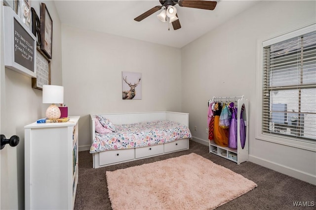 carpeted bedroom with baseboards and a ceiling fan