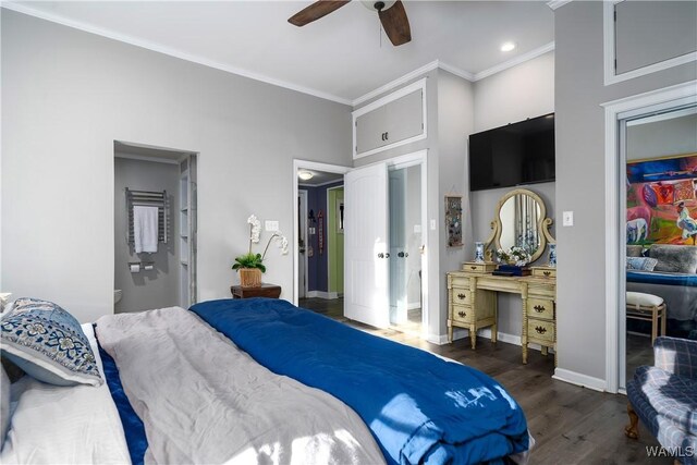 bedroom with dark hardwood / wood-style flooring, ornamental molding, and ceiling fan