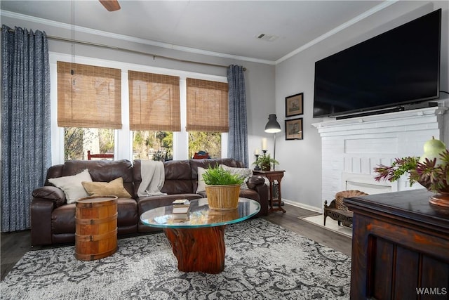 living room with crown molding, ceiling fan, and hardwood / wood-style flooring