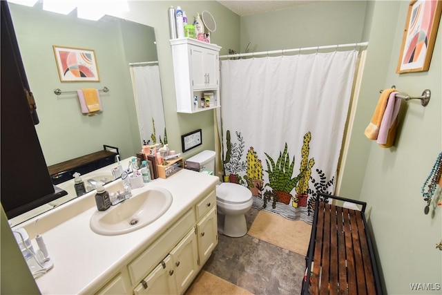 bathroom featuring walk in shower, vanity, and toilet