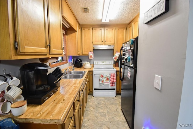 kitchen featuring black fridge, electric stove, sink, a textured ceiling, and butcher block countertops