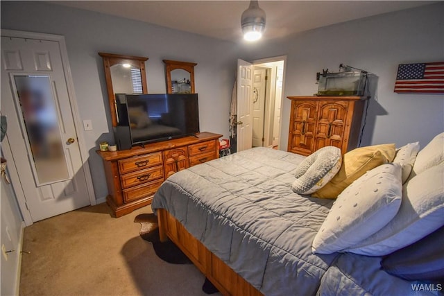 bedroom with ceiling fan and light colored carpet