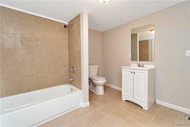 full bathroom featuring tile patterned flooring, vanity, tiled shower / bath combo, and toilet