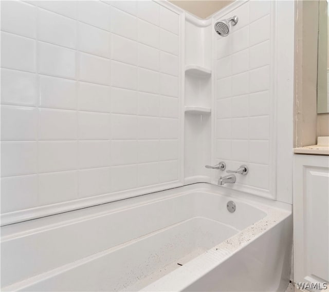 bathroom featuring vanity and tiled shower / bath combo